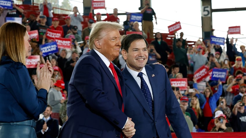 Republican presidential nominee, former U.S. President Donald Trump, appears onstage with U.S. Sen. Marco Rubio (R-FL) (R) and Arkansas Gov. Sarah Huckabee Sanders during a campaign rally at the J.S. Dorton Arena on November 4, 2024 in Raleigh, North Carolina.