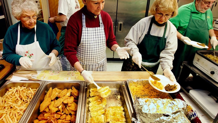 women serving fish fry