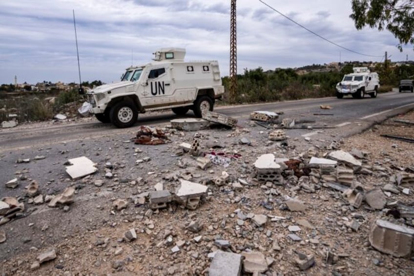 hezbollah and israeli troops exchange fire along the border as 2 people are killed in lebanon