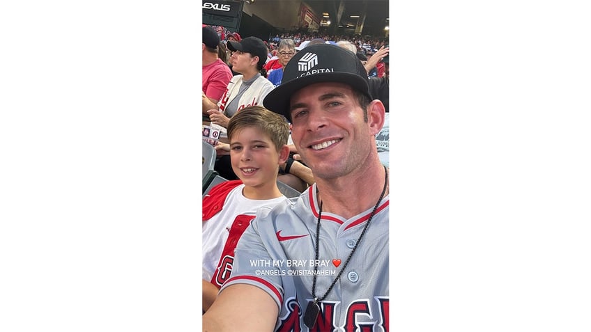 Tarek El Moussa and his son at a baseball game