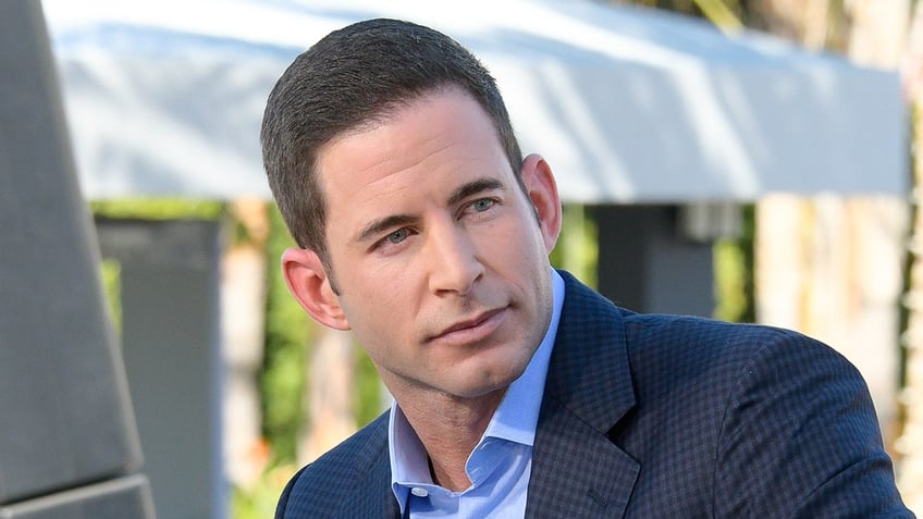 A close-up of Tarek El Moussa looking serious