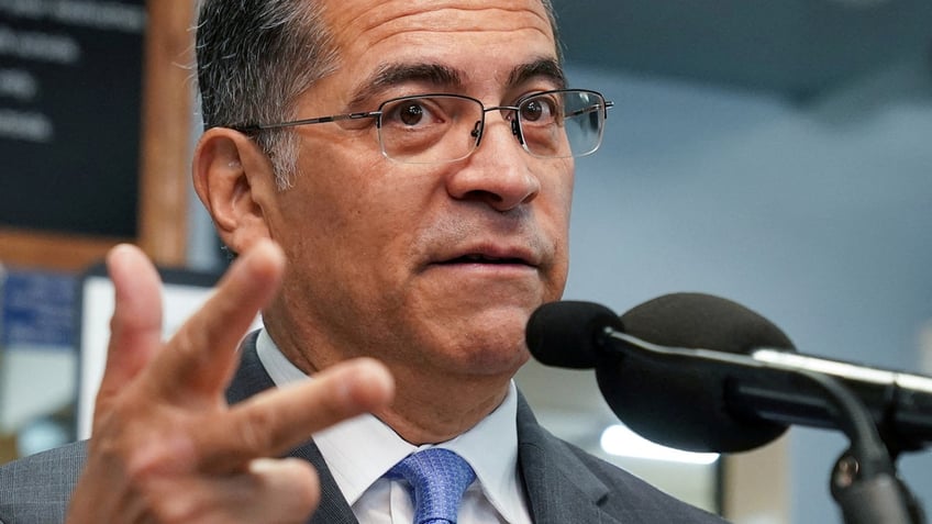 U.S. Health and Human Services Secretary Xavier Becerra speaks during a visit to a pharmacy in Washington