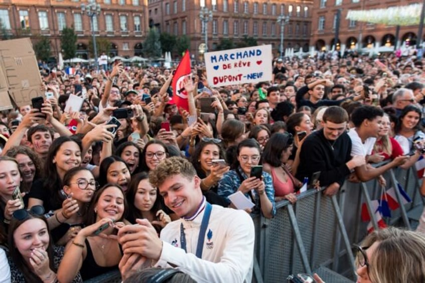 Home hero: Leon Marchand celebrates with the people of Toulouse during a ceremony for the