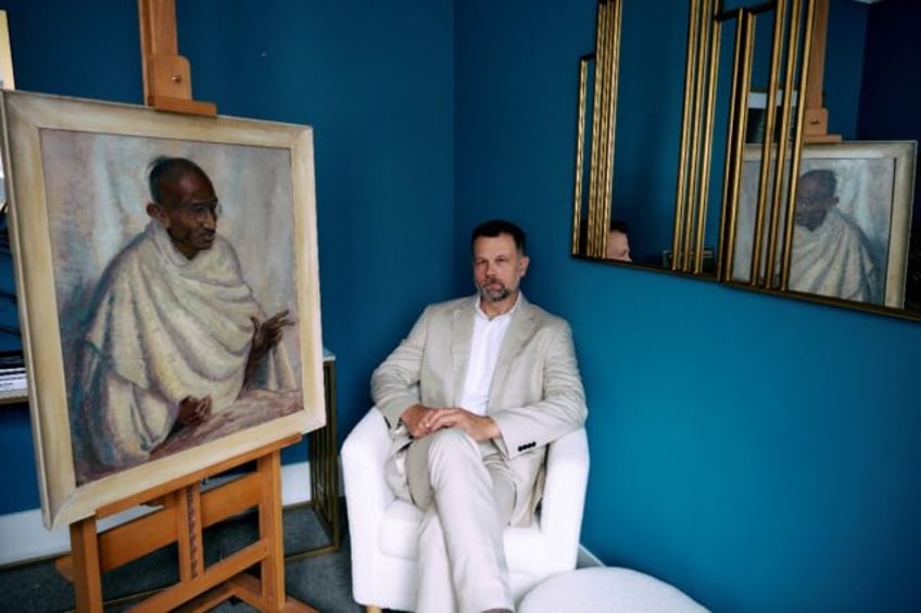 Caspar Leighton with a portrait by his great-aunt of Indian independence leader Mahatma Ga