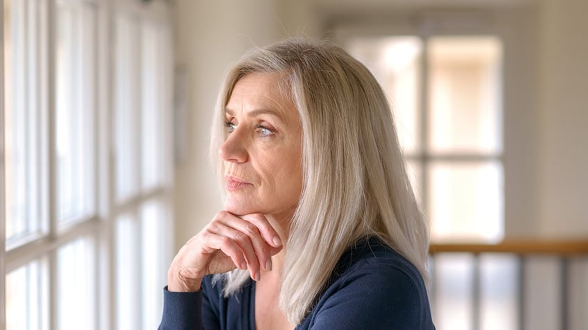 Woman looking out the window