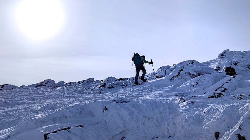 hiker climbing Westside trail