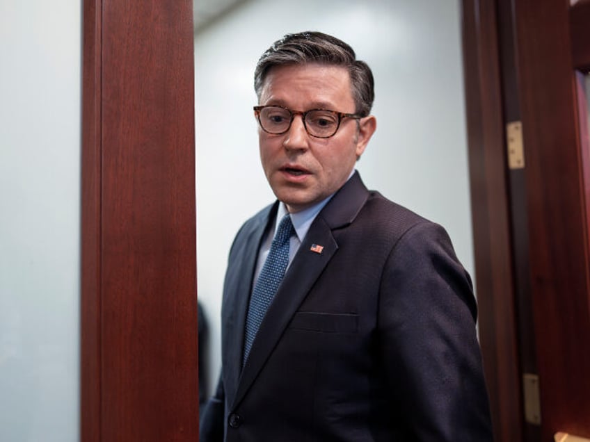 Speaker of the House Mike Johnson, R-La., pauses as he enters a closed-door strategy sessi