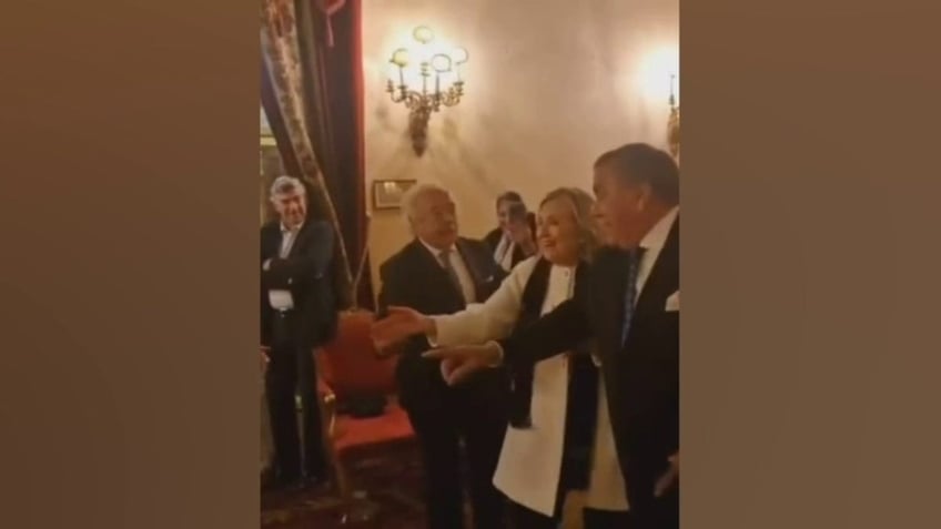 Hillary Clinton seen in viral video dancing to "La Macarena"