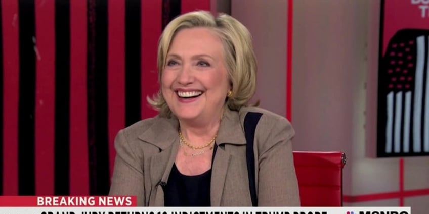 hillary clinton breaks out into laughter before trump indictment oh i cant believe this