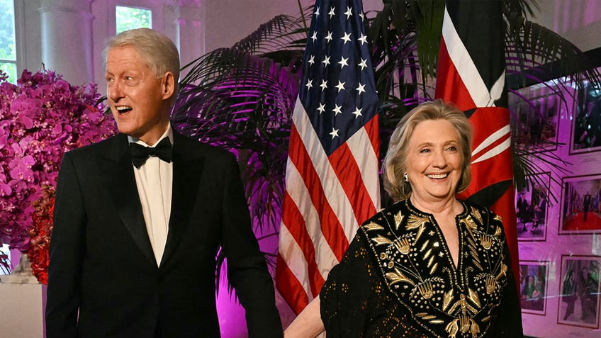 Bill and Hillary Clinton attend event