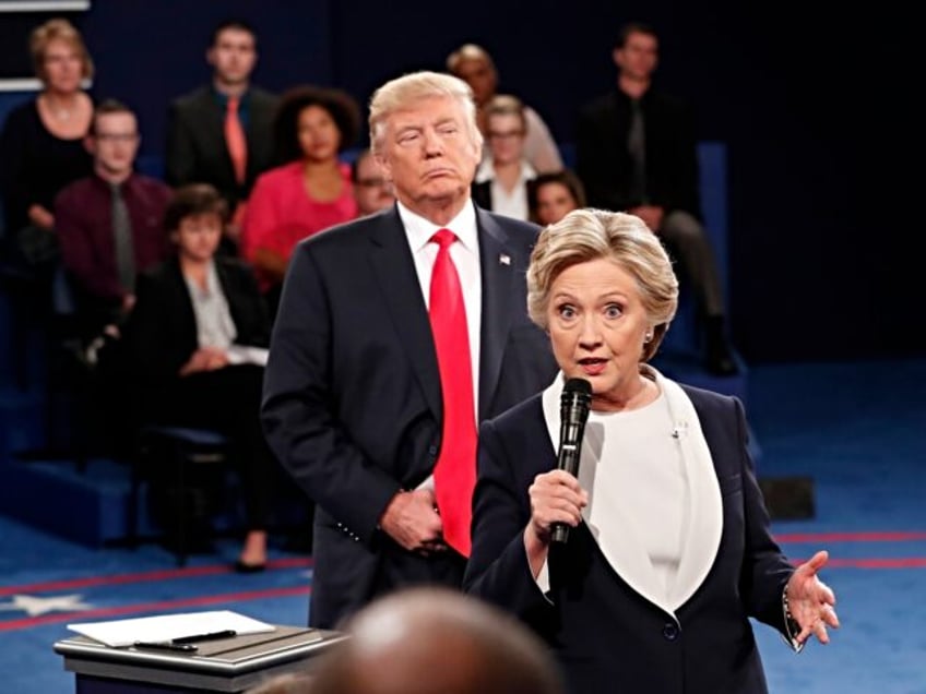 Democratic presidential nominee Hillary Clinton, right, speaks as Republican presidential