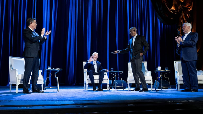 Stephen Colbert clapping with Biden Obama and Clinton