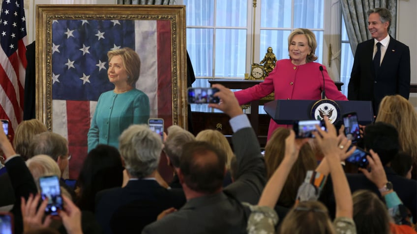 hillary clintons new state department portrait inspires mockery on social media you should be in jail