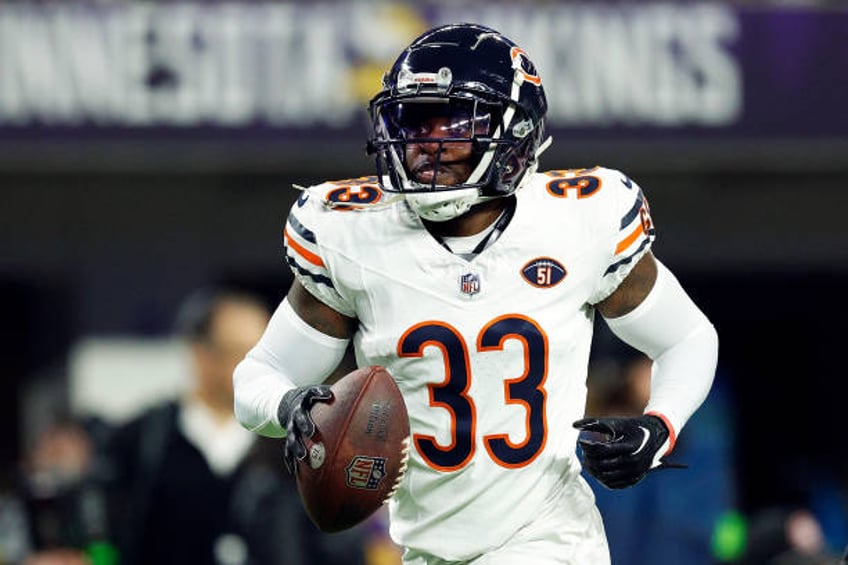 Jaylon Johnson of the Chicago Bears celebrates his interception against the Minnesota Vikings in the first half at U.S. Bank Stadium on November 27,...