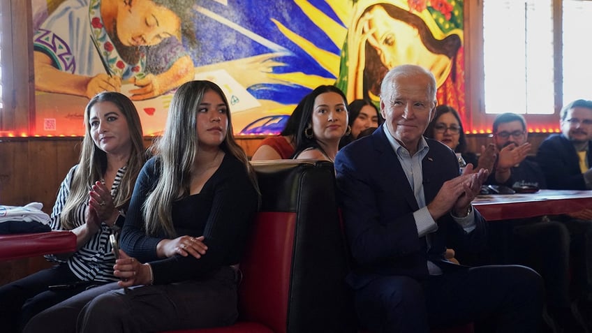 Biden sitting with supporters