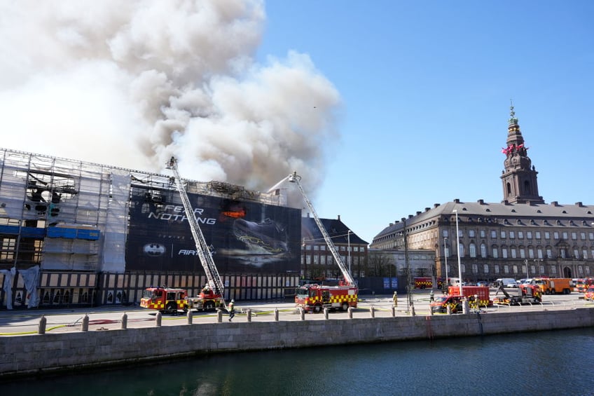 historic artworks rushed into streets as one of copenhagens oldest buildings burns