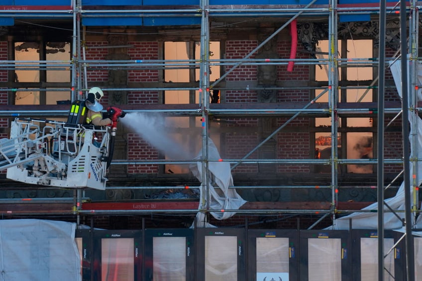 historic artworks rushed into streets as one of copenhagens oldest buildings burns