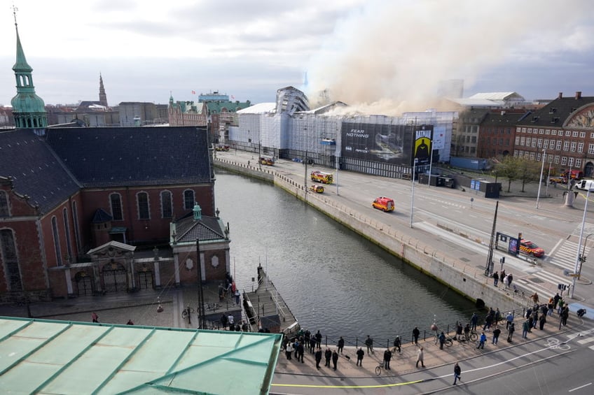 historic artworks rushed into streets as one of copenhagens oldest buildings burns