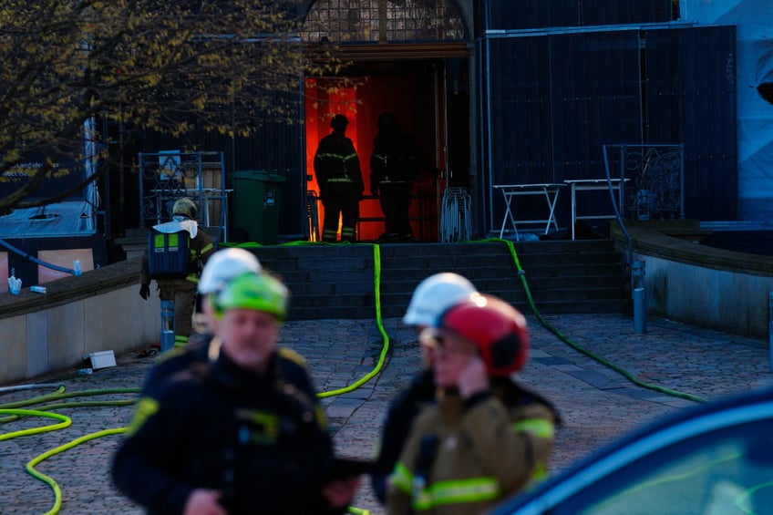 historic artworks rushed into streets as one of copenhagens oldest buildings burns