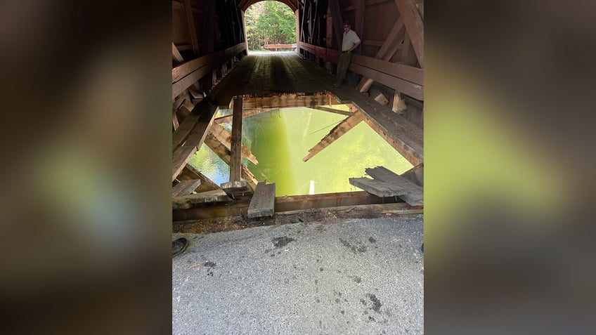 Gaping hole in Maine covered bridge