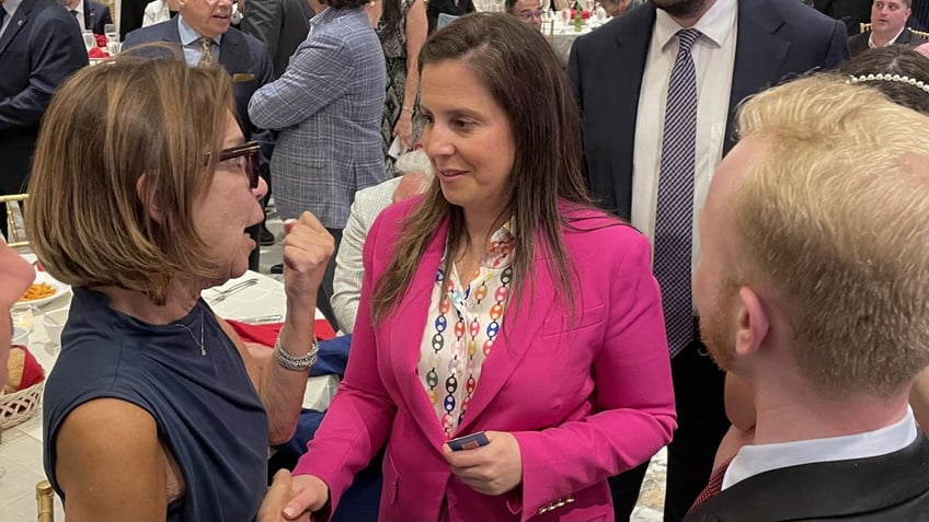 GOP Rep. Elise Stefanik of New York speaks with an attendee at a Staten Island GOP fundraising dinner, on June 2, 2025, in New York City. 