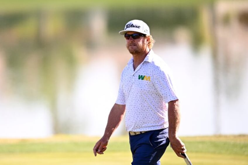 American Charley Hoffman walks on the 18th green on the way to a share of the second-round