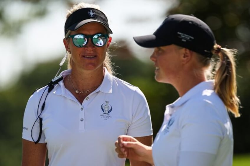 Europe captain Suzann Pettersen and fellow Swede Maja Stark talk during a practice session