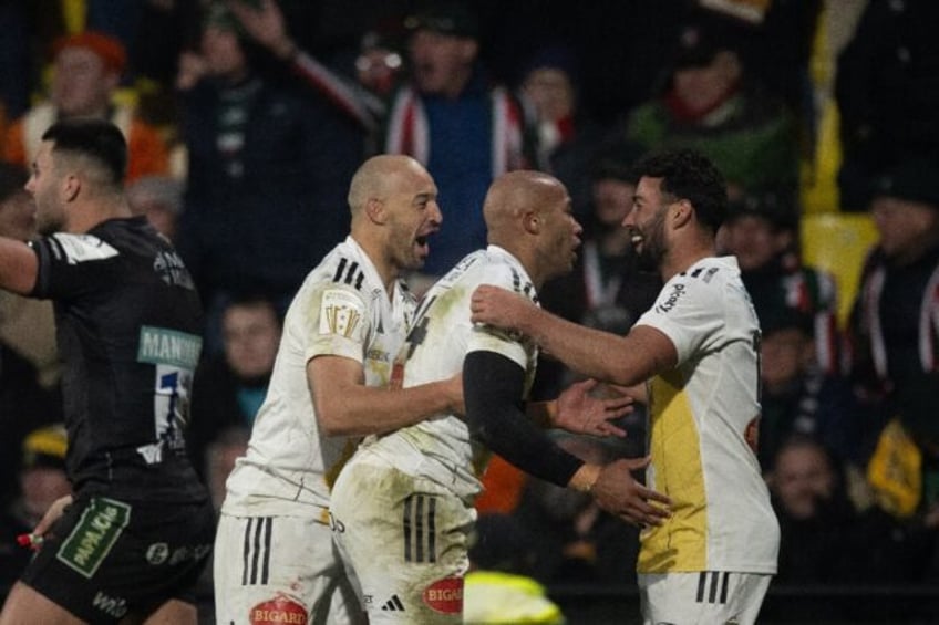 Teddy Thomas (C) celebrates one of his tries against Leicester Tigers