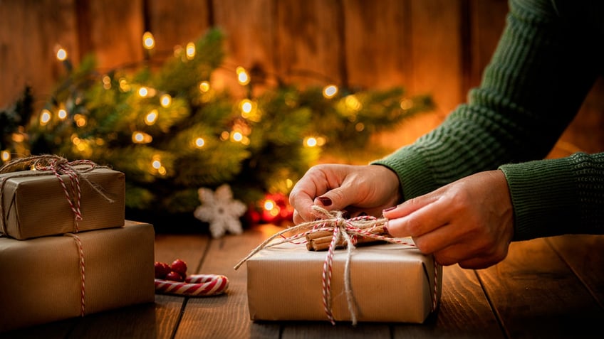 Woman wrapping a Christmas gift