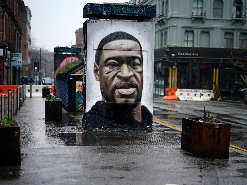 MANCHESTER, UNITED KINGDOM - JANUARY 13: Social distance markers adorn the deserted paveme