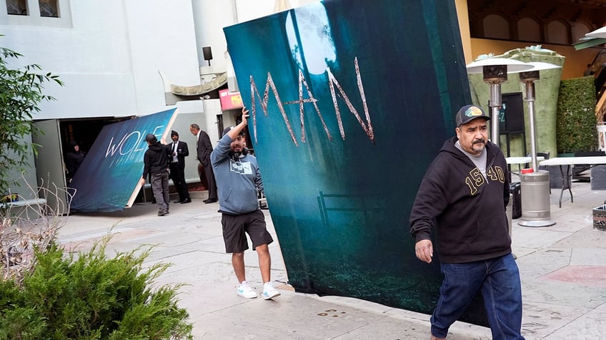 Wolf Man premiere sign being moved