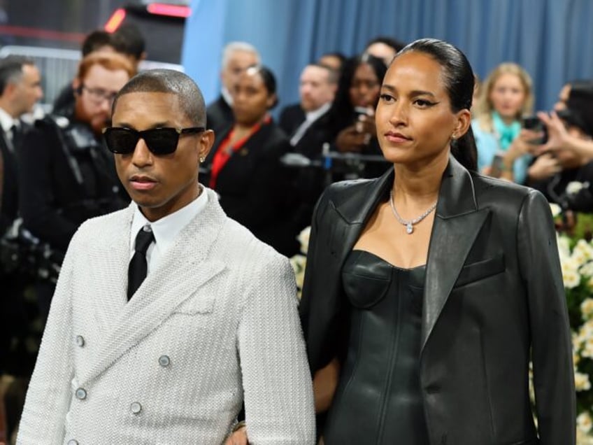NEW YORK, NEW YORK - MAY 05: (L-R) Pharrell Williams, Met Gala Co-Chair, and Helen Lasicha