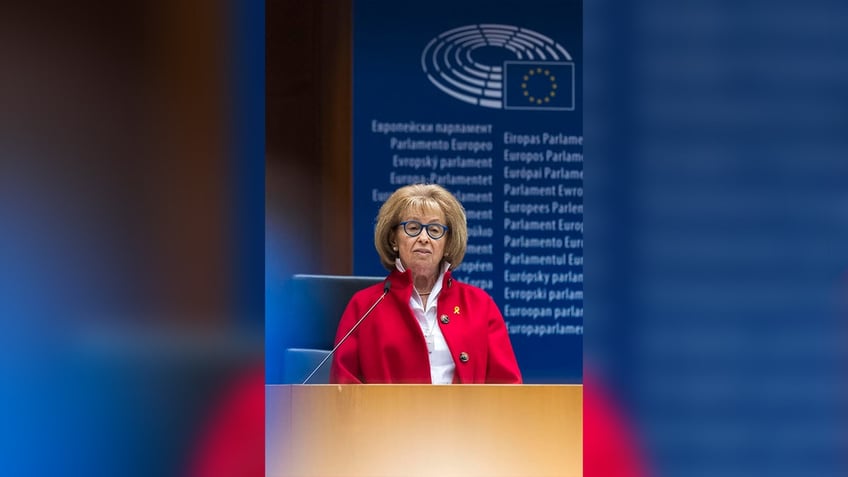 woman speaks at podium