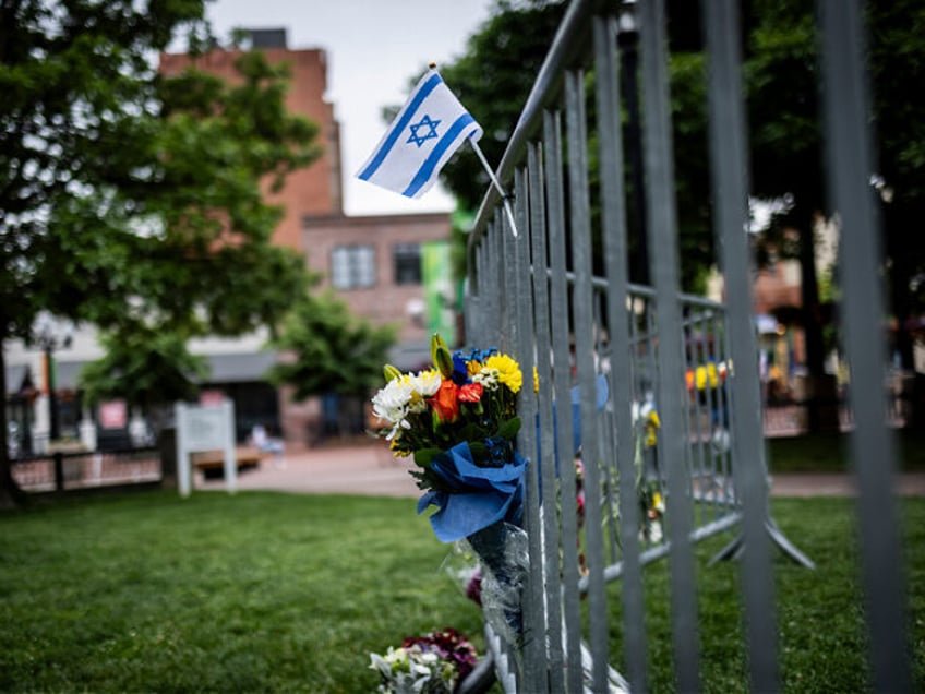 BOULDER, COLORADO - JUNE 2: Flowers and a flag at the site of the attack outside the Bould