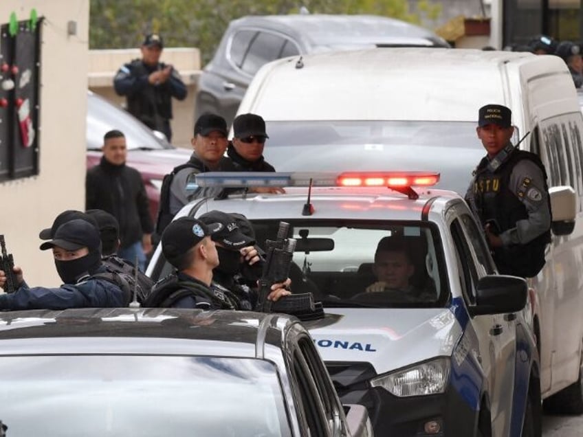 Special police forces escort a van where allegedly is transported former Honduran Joint Ch