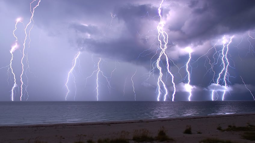 This is a combination of five following 30 second exposures.  The view crosses the beach and the Gulf of Mexico from Anna Maria Island, Florida, USA.