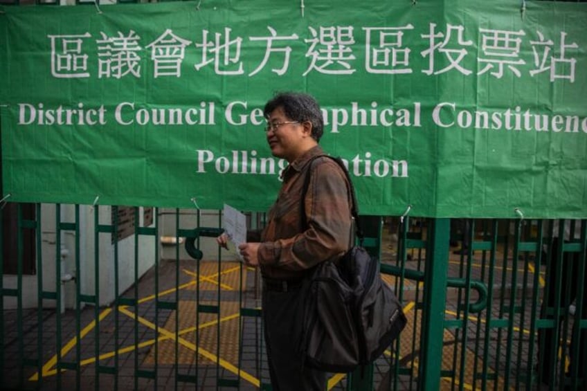 A voter is seen outside a polling station for district elections in Hong Kong on Sunday