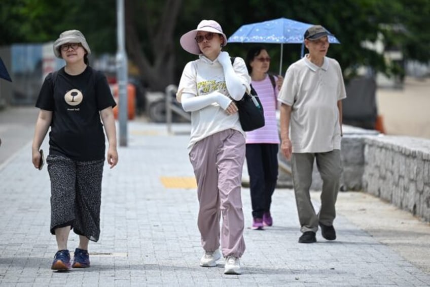 Hong Kong matched Friday its record for the hottest summer solstice with temperatures reac