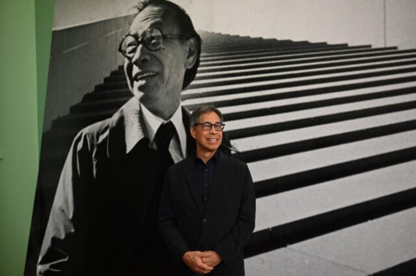 Sandi Pei, son of renowned Chinese-American architect I.M. Pei, poses in front of a photo