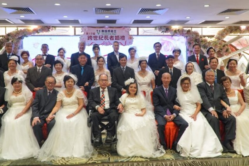 20 elderly couples renewed their vows in a Hong Kong mass wedding party aiming to highligh