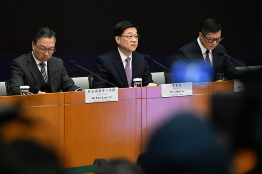 Hong Kong will create its own national security law "as soon as possible", city leader John Lee (C) said Tuesday