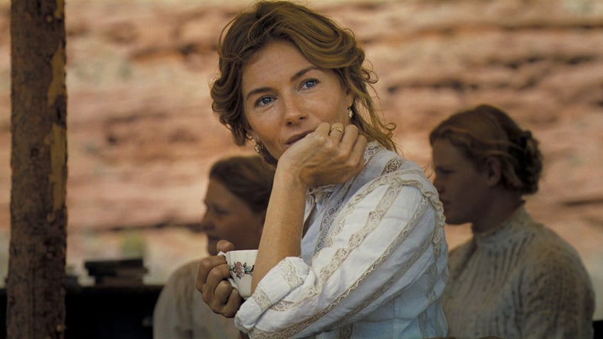 Sienna Miller sits on set of Kevin Costner country film Horizon.