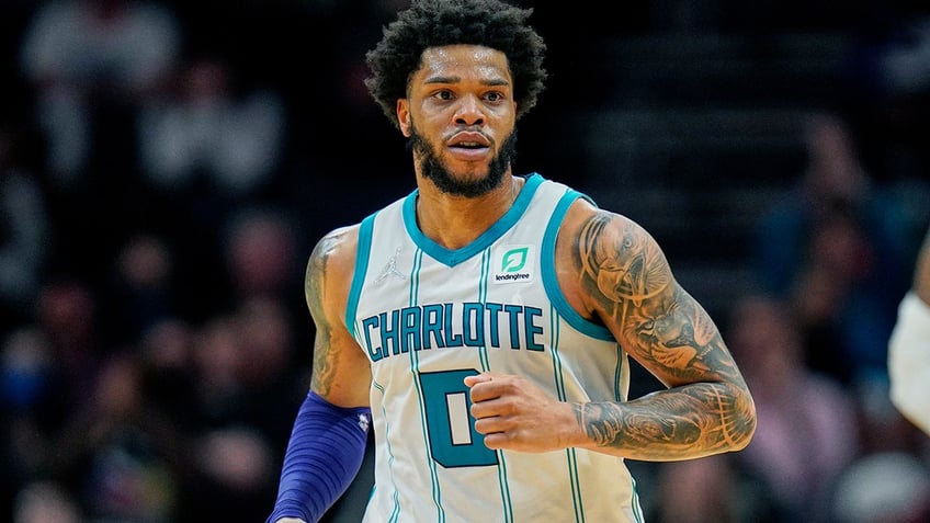 hornets star has arrest warrant issued for alleged protective order violation from domestic charge report