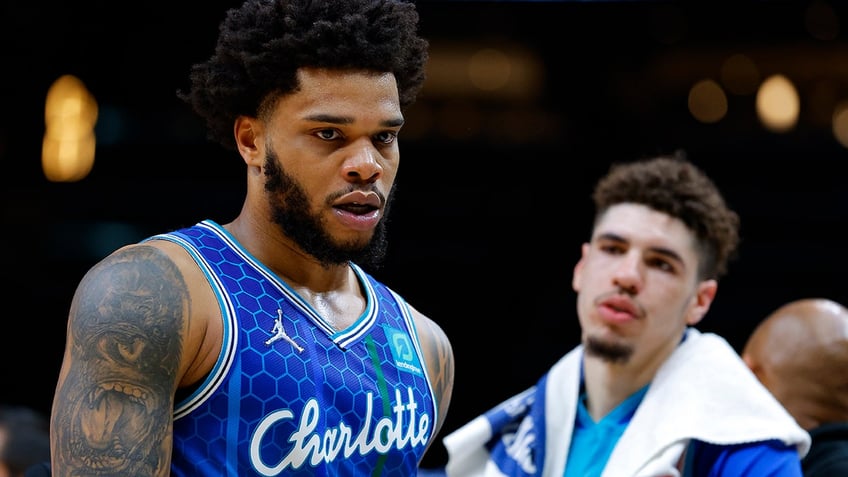 hornets star has arrest warrant issued for alleged protective order violation from domestic charge report