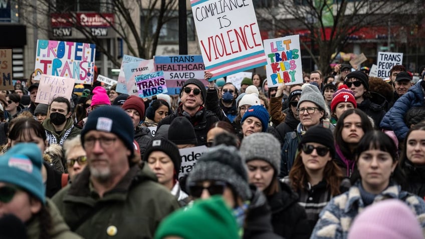 Demonstrators during the Rise Up for Trans Youth rally against President Donald Trump's executive actions targeting transgender people at Union Square in New York, US, on Saturday, Feb. 7, 2025. Three of New York's most prominent hospitals are curbing transgender medical care for minors after President Donald Trump's executive orders put at risk billions of dollars in federal funding. 