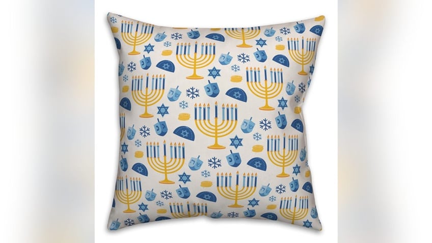 Add a few throw pillows to your couch or bed. 