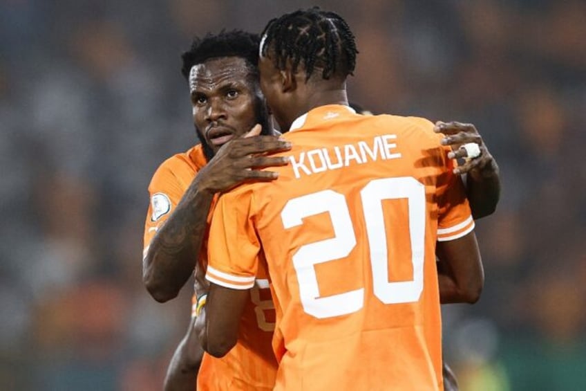 Franck Kessie (L) celebrates scoring for Ivory Coast with Christian Kouame.