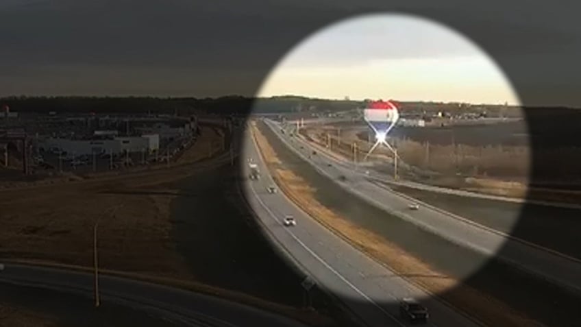 A hot air balloon crashes into a power line causing sparks