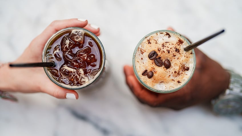 Two cold brew beverages with straws