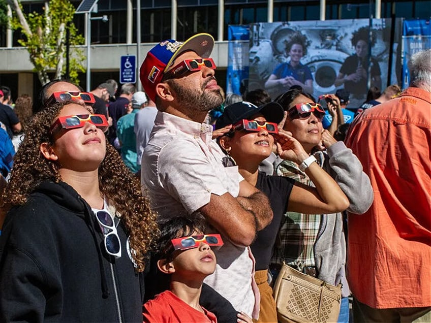 HOUSTON, TEXAS - OCTOBER 14: Astronauts answer questions via live video feed from the Inte